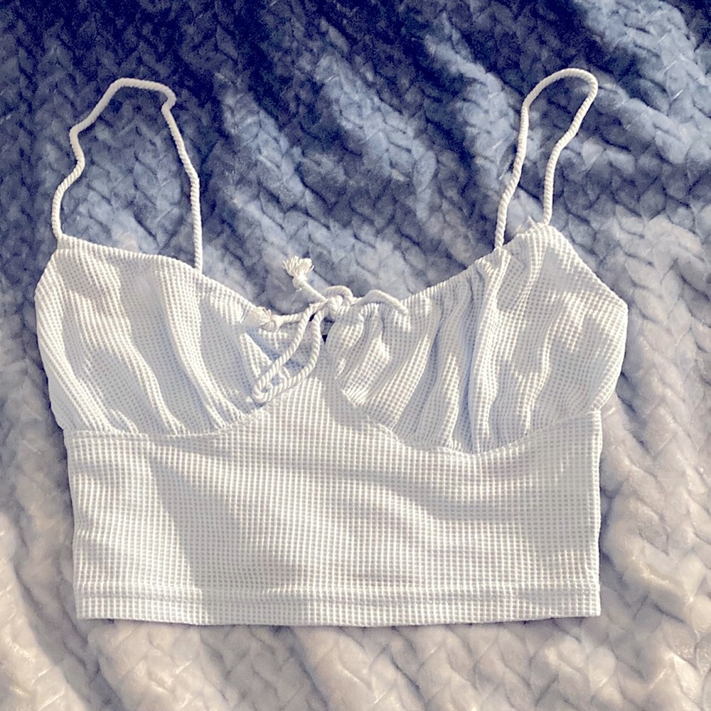 The color is baby blue , it’s originally a small but fits like a medium.